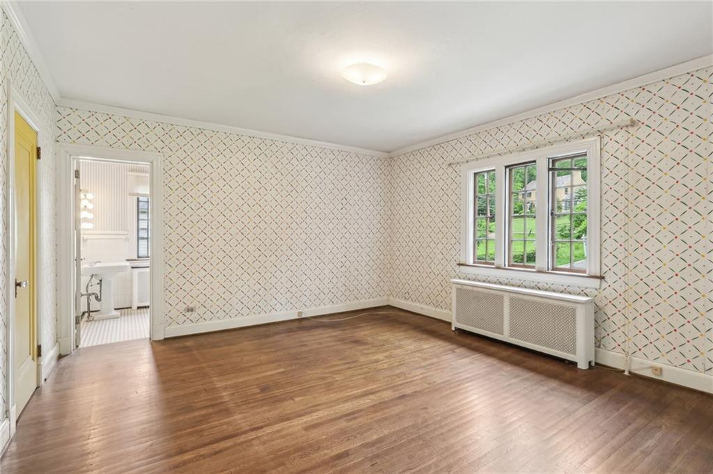 634 West Waldheim Road Pittsburgh, PA 15215 - Photo 30 of 50 an empty room with wooden floor and windows