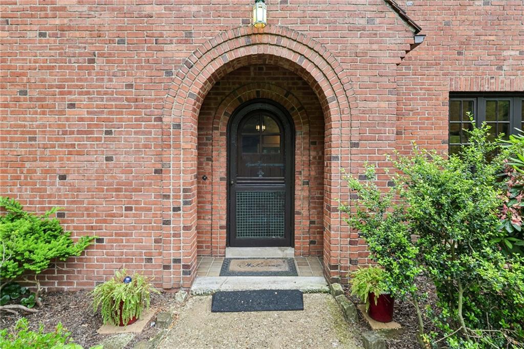 634 West Waldheim Road Pittsburgh, PA 15215 - Photo 3 of 50 a view of a stone house with potted plants