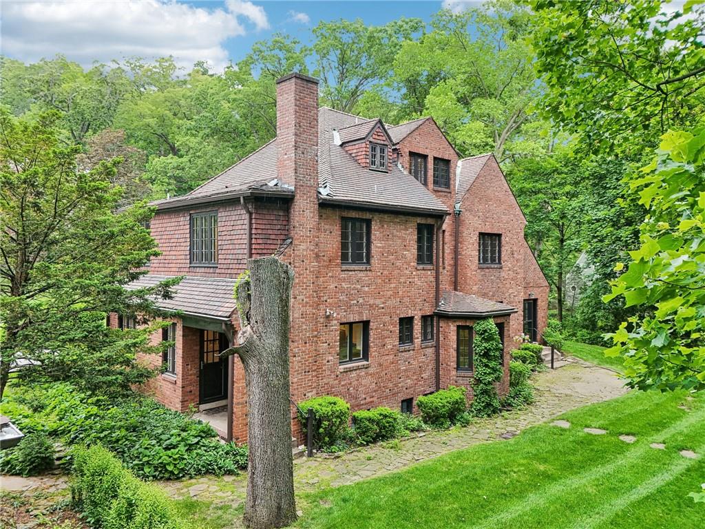 634 West Waldheim Road Pittsburgh, PA 15215 - Photo 45 of 50 a front view of a house with garden
