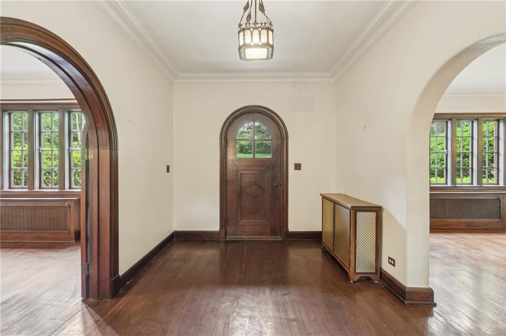 634 West Waldheim Road Pittsburgh, PA 15215 - Photo 5 of 50 an empty room with wooden floor mirror and windows