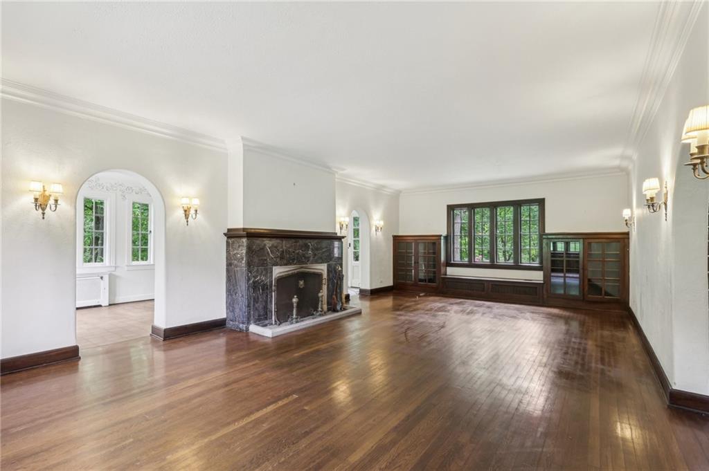 634 West Waldheim Road Pittsburgh, PA 15215 - Photo 7 of 50 a view of empty room with fireplace and wooden floor
