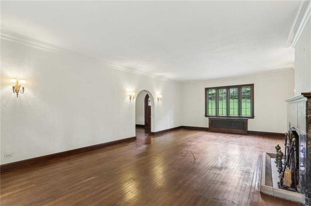 634 West Waldheim Road Pittsburgh, PA 15215 - Photo 8 of 50 an empty room with wooden floor and windows