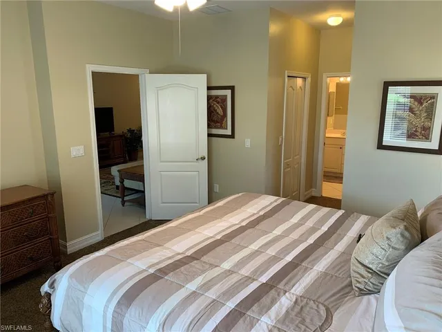 a bedroom with a bed and a closet