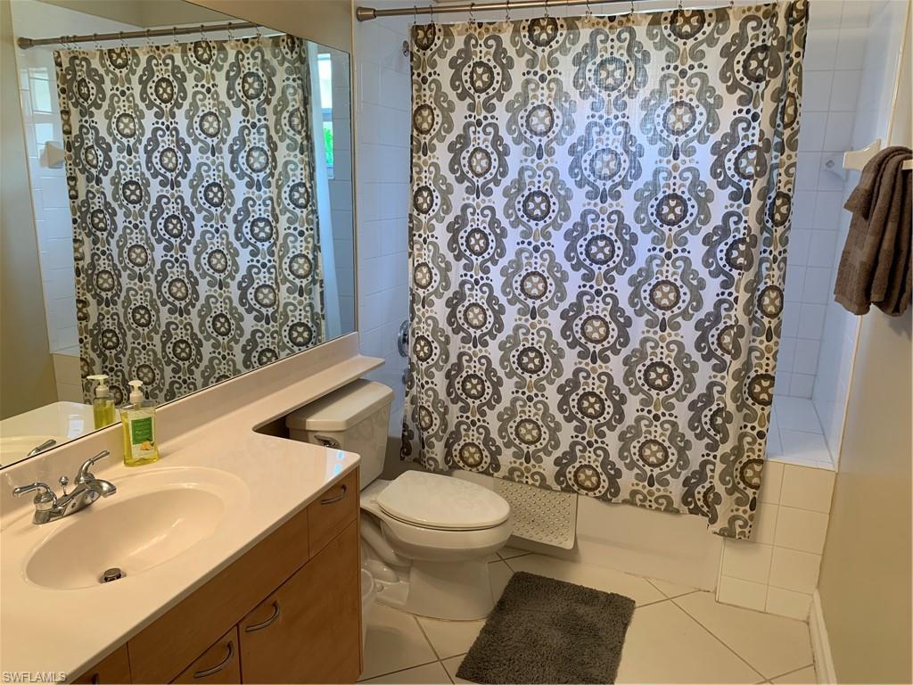 8133 Chancel Court, Unit 641 Naples, FL 34104 - Photo 15 of 25 a bathroom with a sink toilet and shower