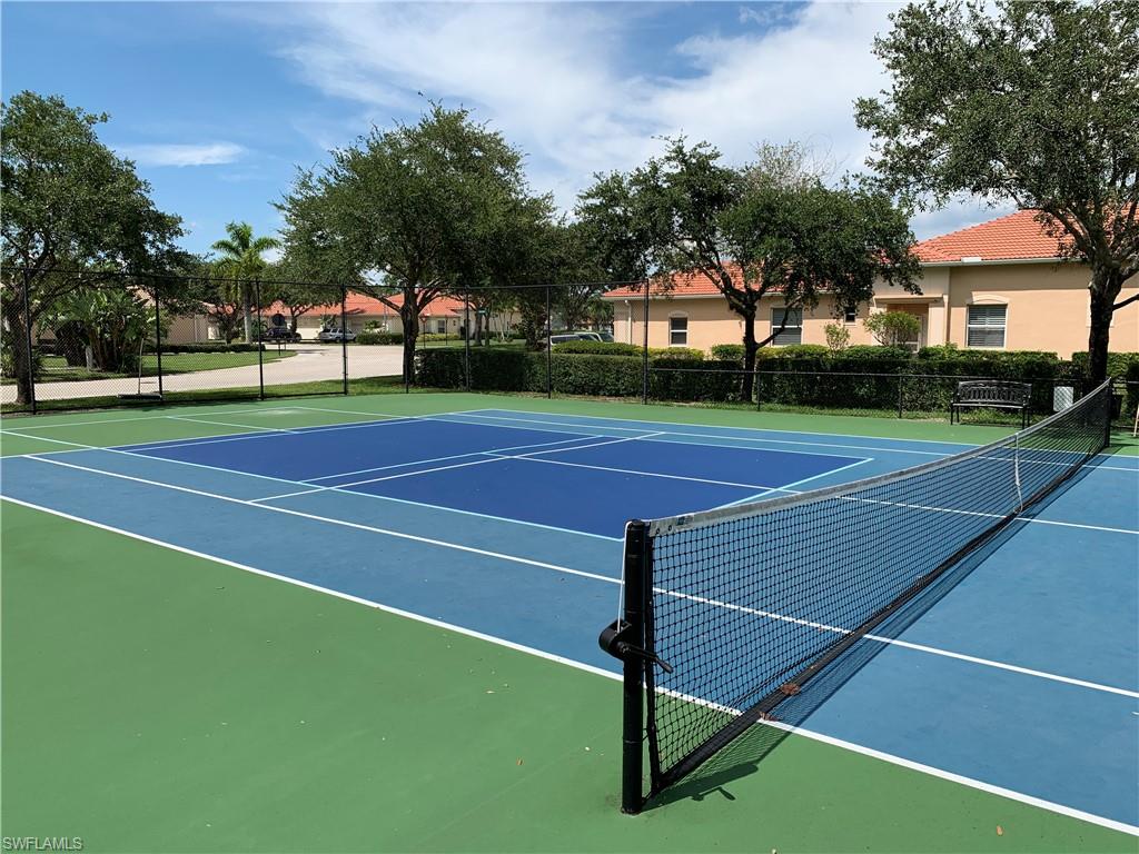 8133 Chancel Court, Unit 641 Naples, FL 34104 - Photo 21 of 25 a view of a tennis court