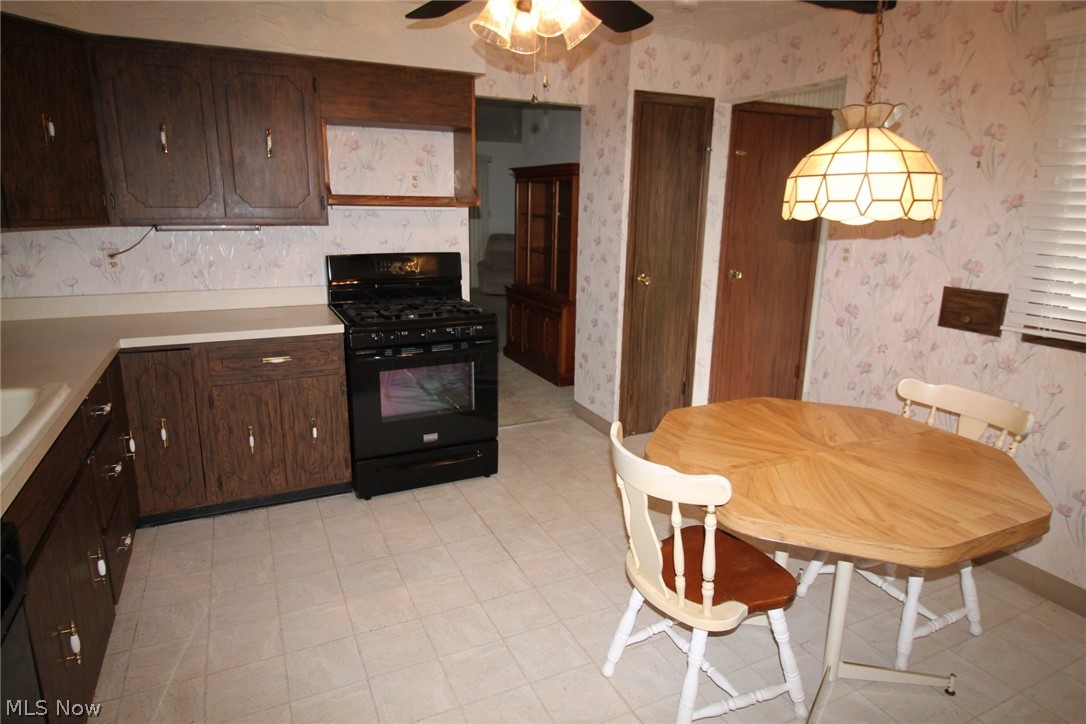 7930 Royal Ridge Drive Parma, OH 44129 - Photo 4 of 24 MICROWAVE SHELF ABOVE THE NEWER STOVE. PANTRY TO THE RIGHT OF THE STOVE.