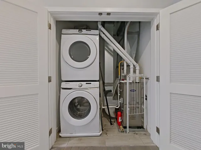a bathroom with a toilet sink a mirror and shower