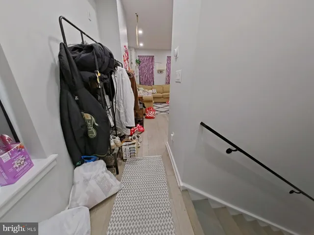 a view of a hallway with storage and utility