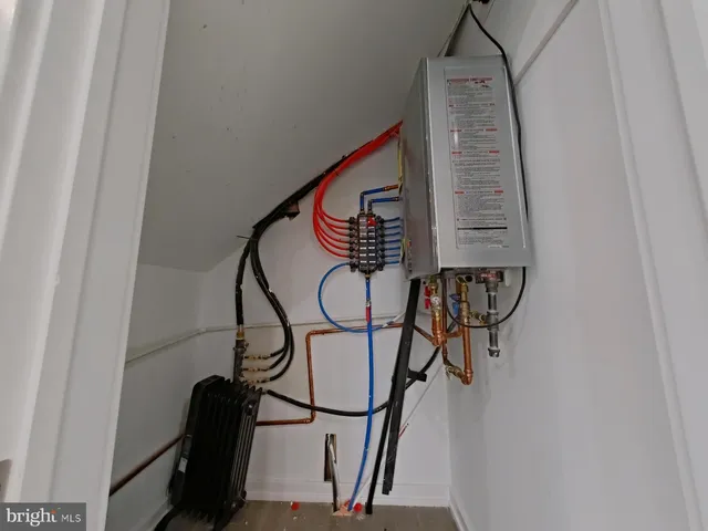 a living room with furniture and a mirror