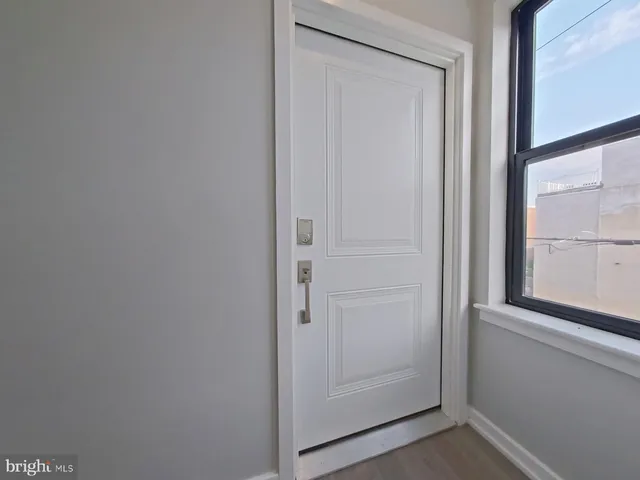 a kitchen with stainless steel appliances granite countertop a stove top oven a sink dishwasher and a refrigerator