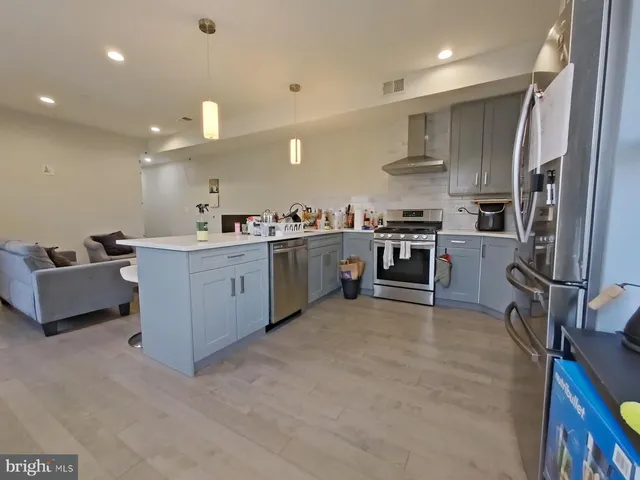 a room with furniture pool table and windows