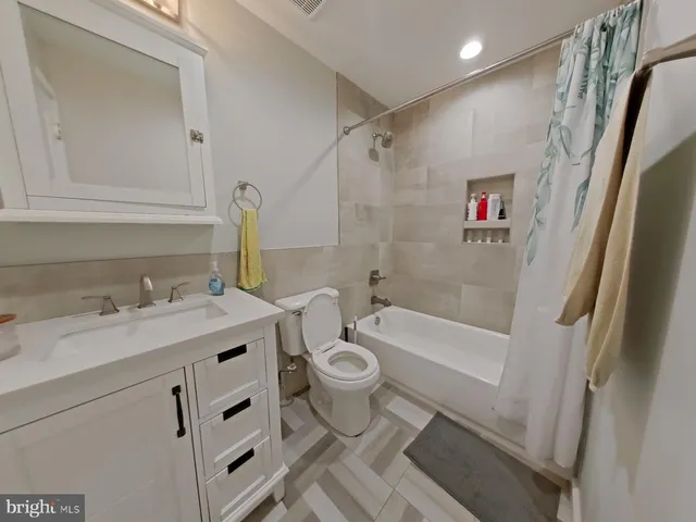 a bedroom with furniture and a gym equipment