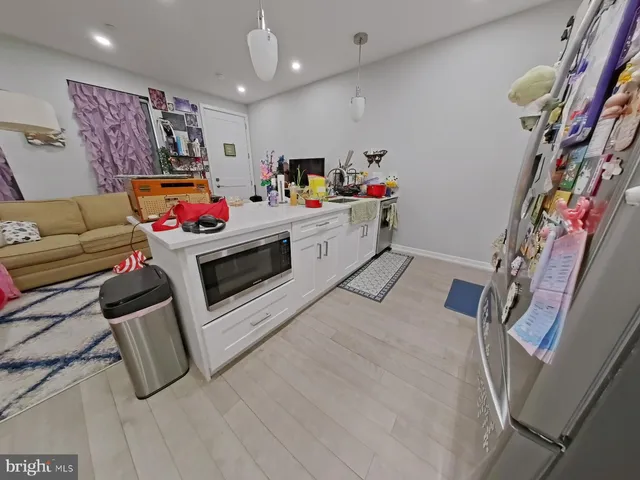 a storage room with furniture and white walls