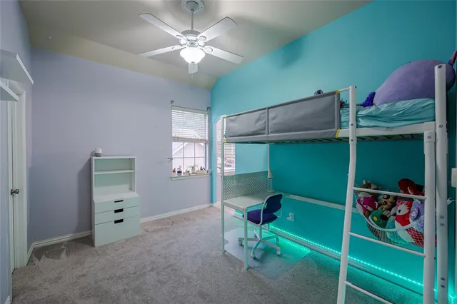 a room with furniture and a fan