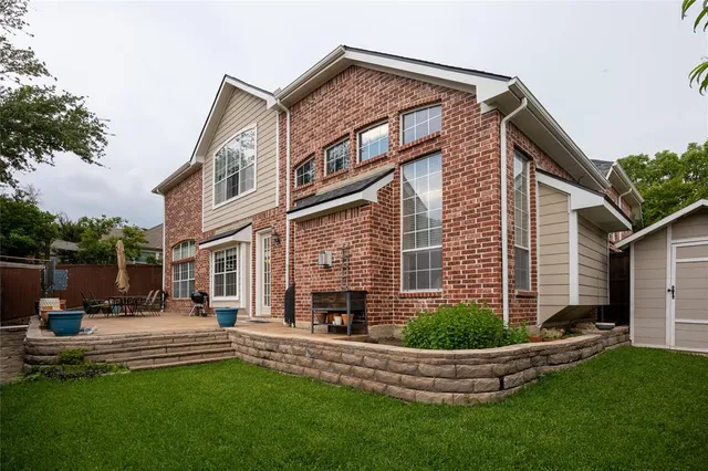 a front view of a house with a yard table and chairs