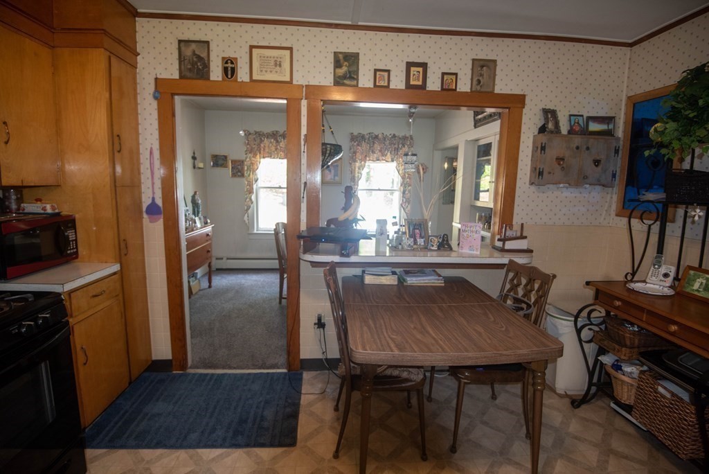 120 Adams Street Barre, MA 01005 - Photo 14 of 42 a view of kitchen island dining table and chairs