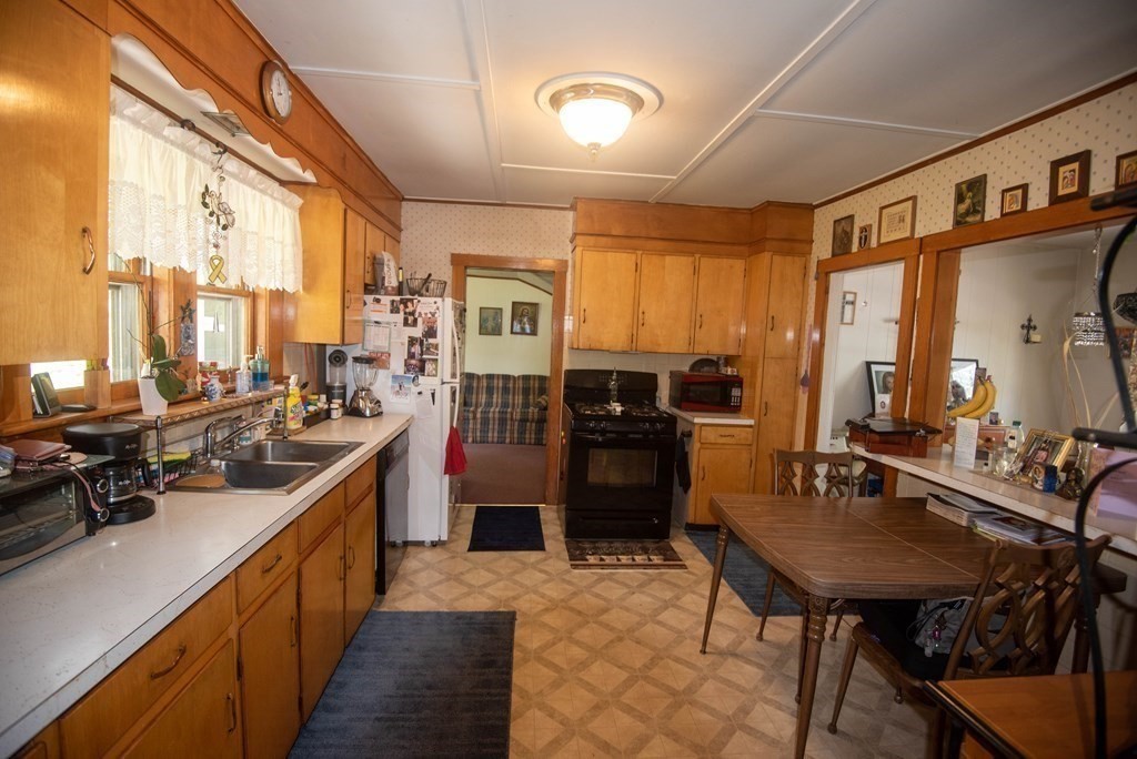120 Adams Street Barre, MA 01005 - Photo 17 of 42 a kitchen with stainless steel appliances a sink stove and refrigerator