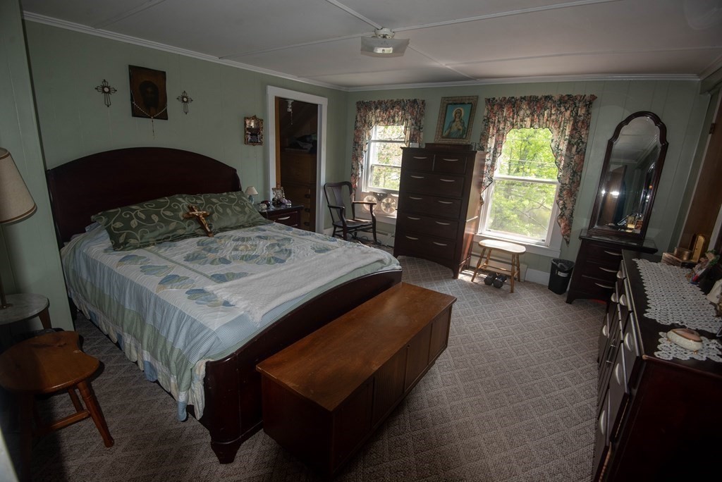 120 Adams Street Barre, MA 01005 - Photo 24 of 42 a bedroom with a bed a dresser next to a window