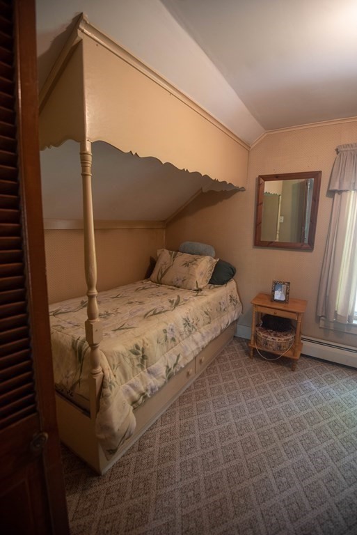 120 Adams Street Barre, MA 01005 - Photo 26 of 42 a bedroom with a bed and a flat screen tv