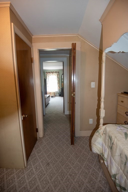 120 Adams Street Barre, MA 01005 - Photo 28 of 42 a bedroom with a bed and a mirror