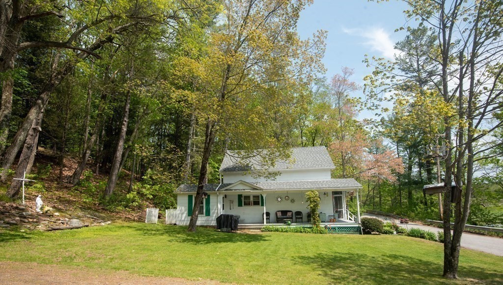 120 Adams Street Barre, MA 01005 - Photo 5 of 42 a view of a fountain with tree in front of the house