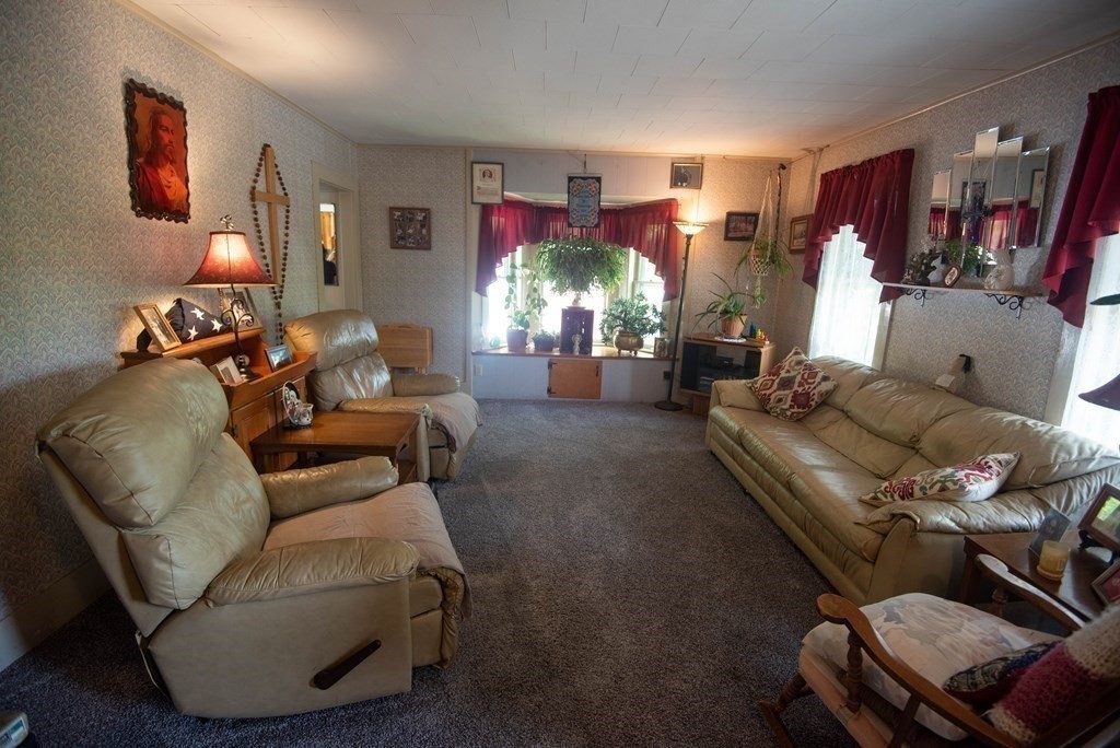 120 Adams Street Barre, MA 01005 - Photo 10 of 42 a living room with furniture and a large window