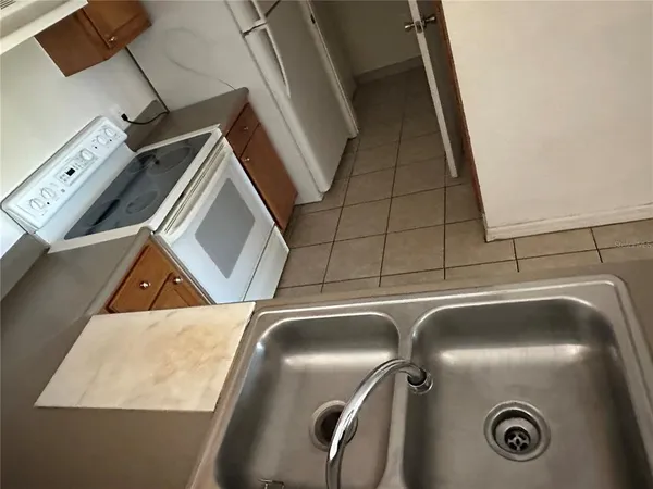 a close view of a stove and refrigerator