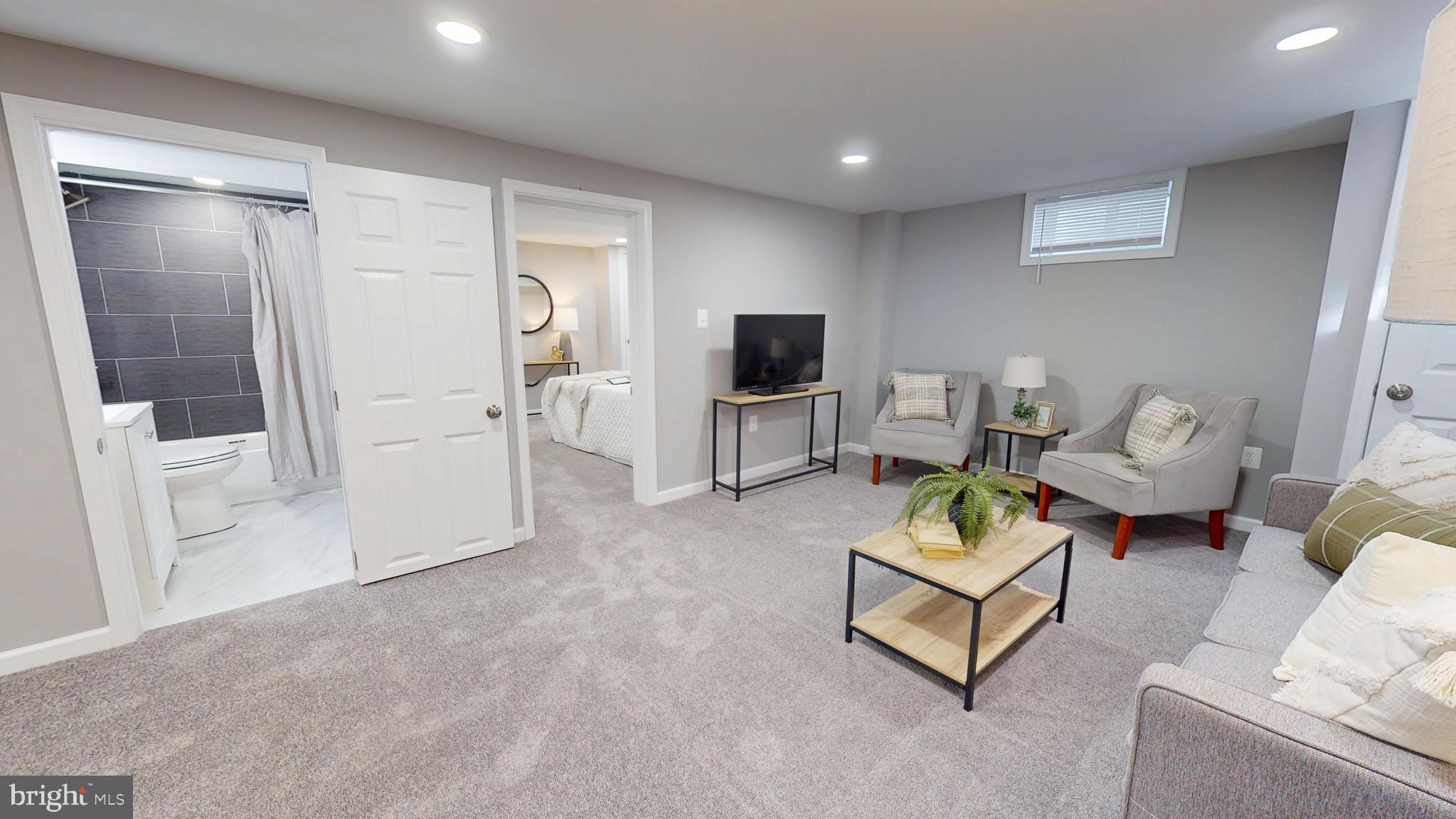 6211 Johnnycake Road Gwynn Oak, MD 21207 - Photo 20 of 26 a living room with furniture and a flat screen tv