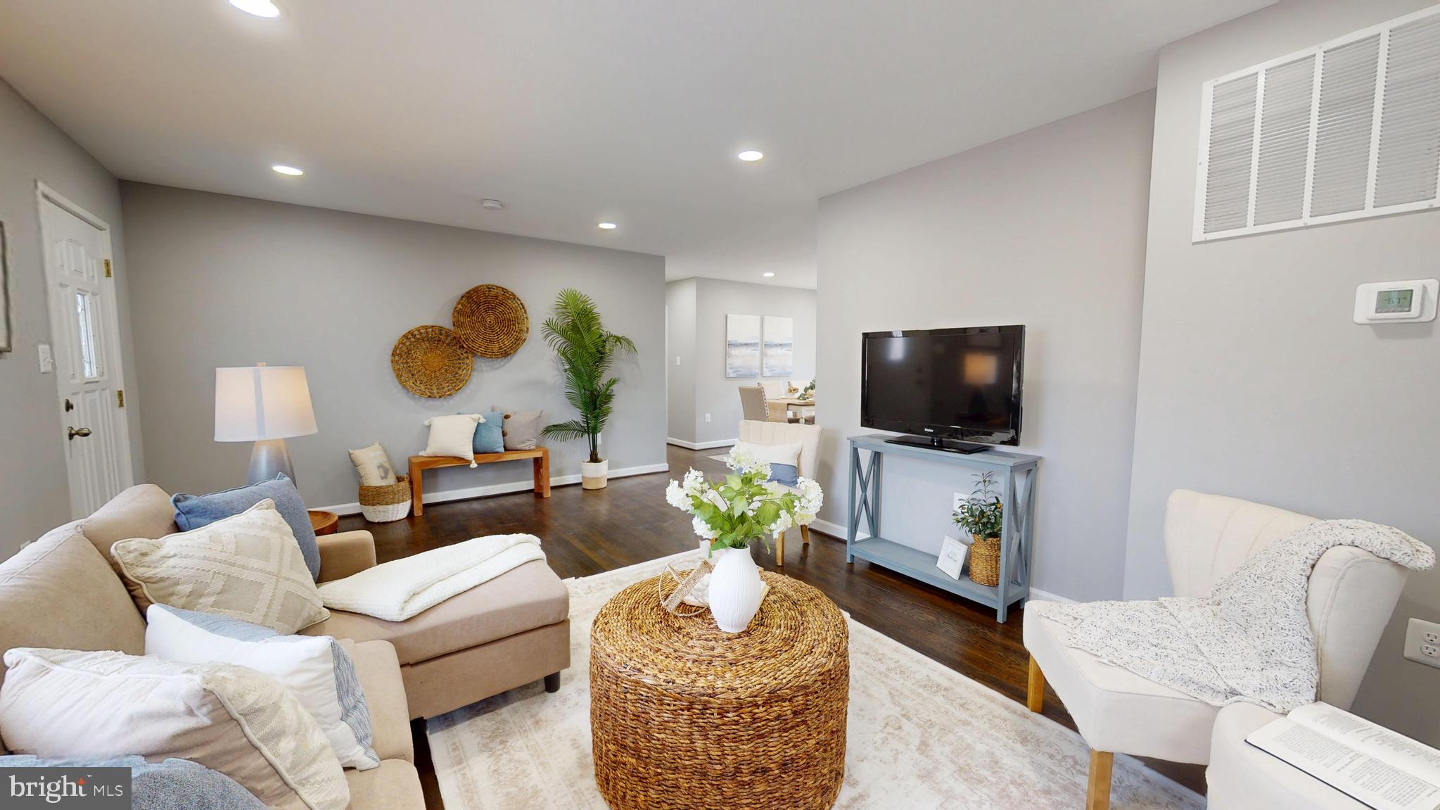 6211 Johnnycake Road Gwynn Oak, MD 21207 - Photo 3 of 26 a living room with furniture and a flat screen tv