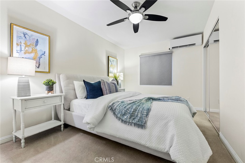 1608 Cedar Avenue Long Beach, CA 90813 - Photo 17 of 45 a bedroom with a bed and a chandelier