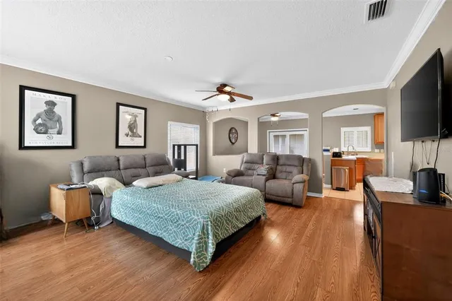 a living room with furniture a window and a chandelier