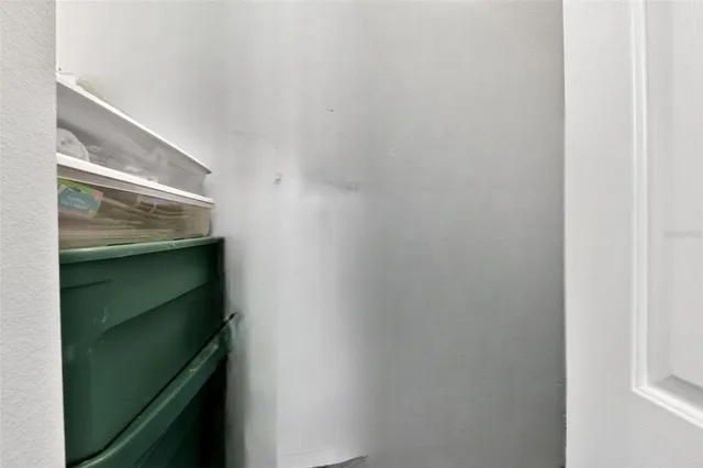 a view of a hallway with a room