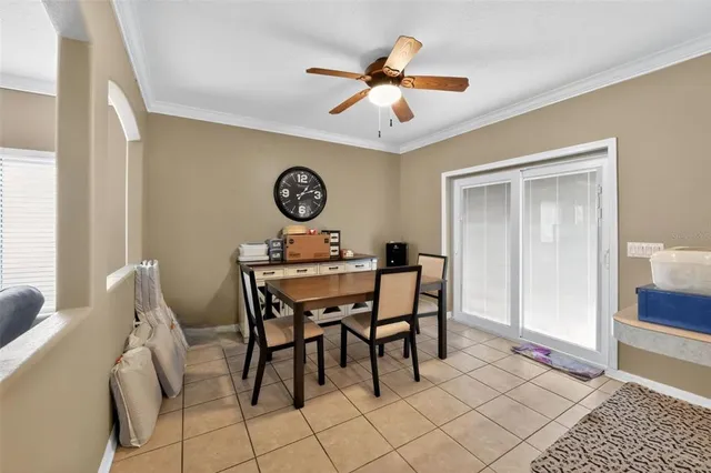 a view of a livingroom and a dining table & chairs