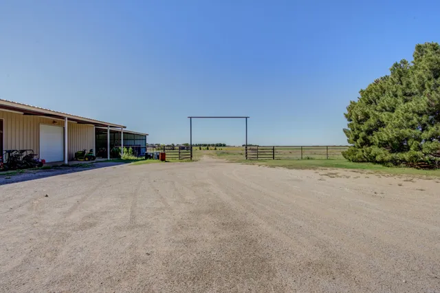 a bedroom with a bed and a large mirror