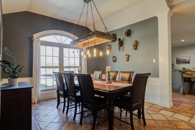 a kitchen with stainless steel appliances granite countertop a sink and cabinets