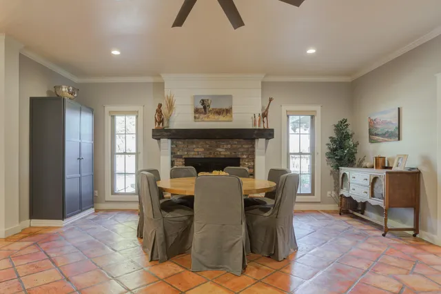 a spacious bedroom with a bed and a flat screen tv