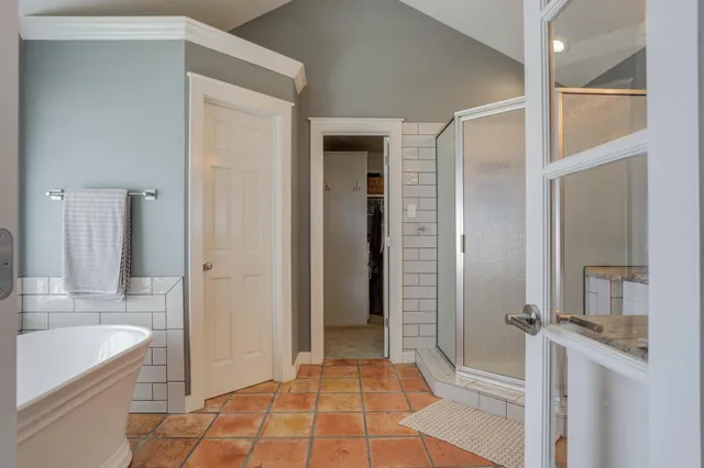 a bathroom with a shower a toilet and a sink