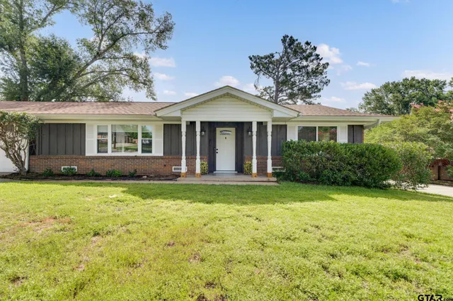 front view of a house with a yard