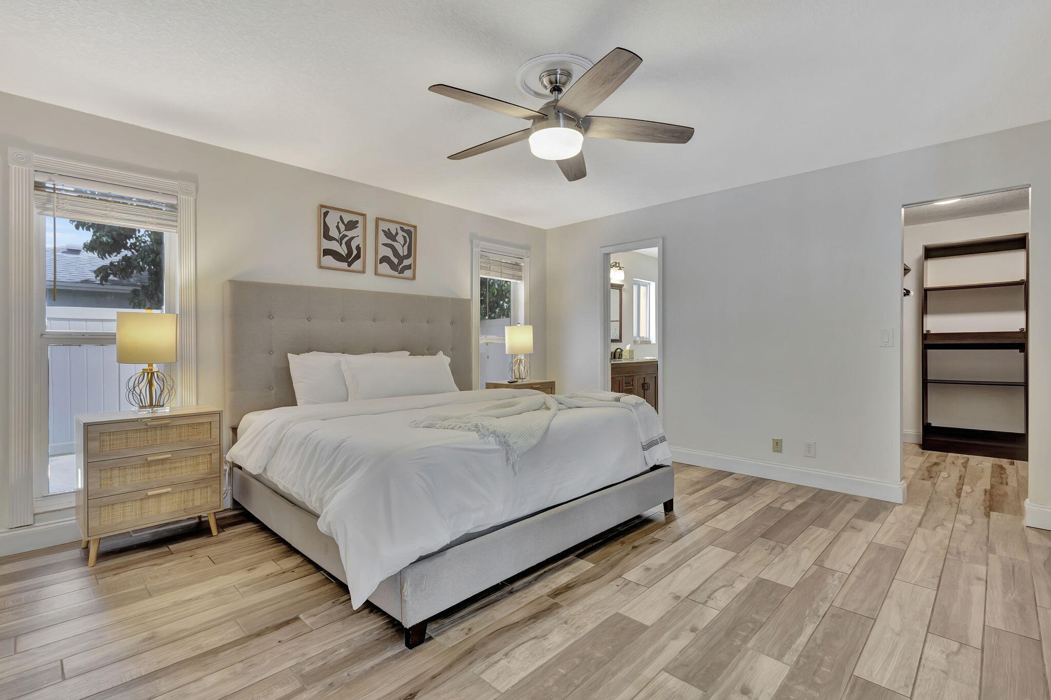 1104 Jackpine Street Wellington, FL 33414 - Photo 11 of 67 a bedroom with a bed and a ceiling fan