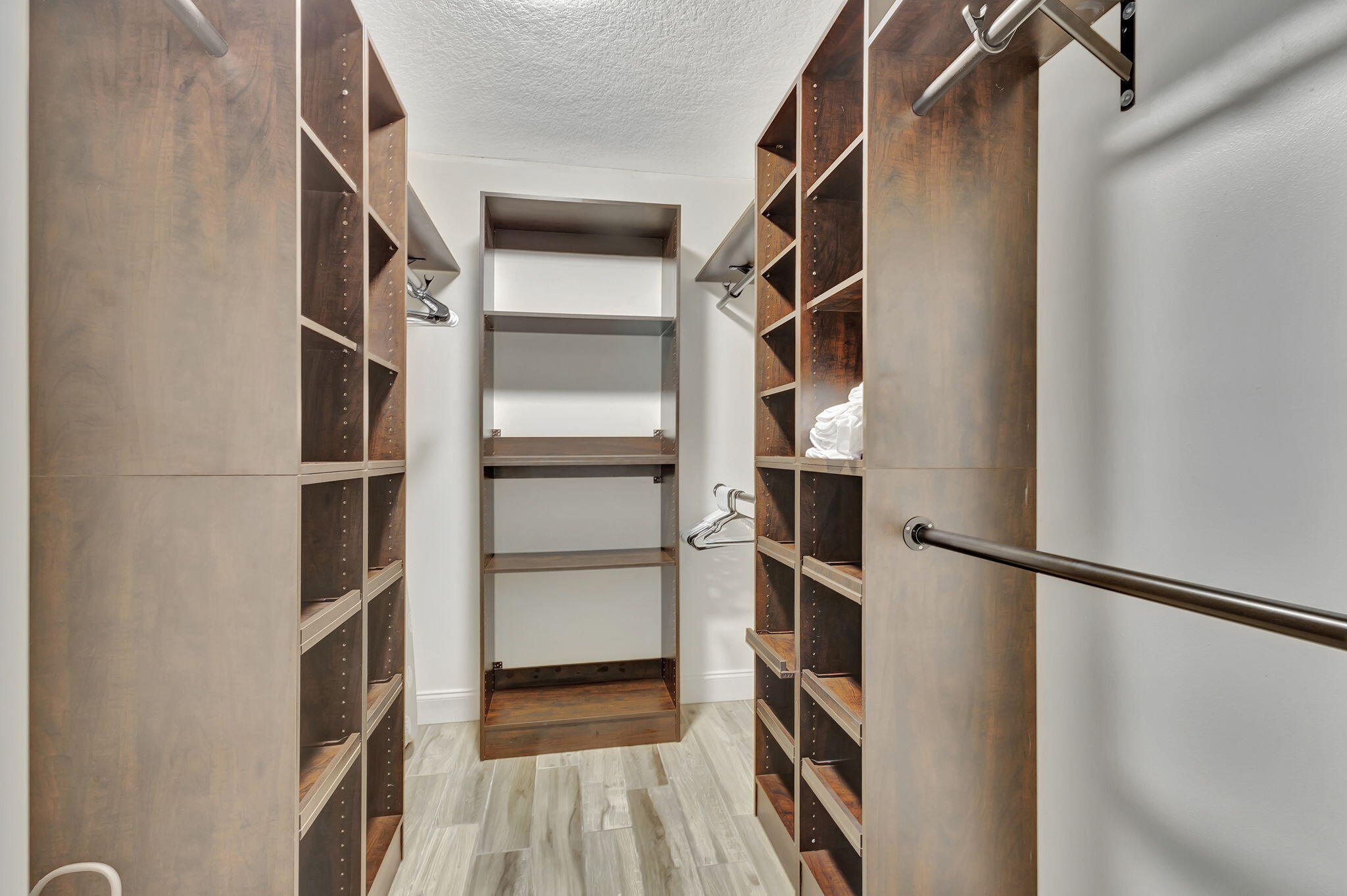 1104 Jackpine Street Wellington, FL 33414 - Photo 14 of 67 a view of walk in closet with empty racks