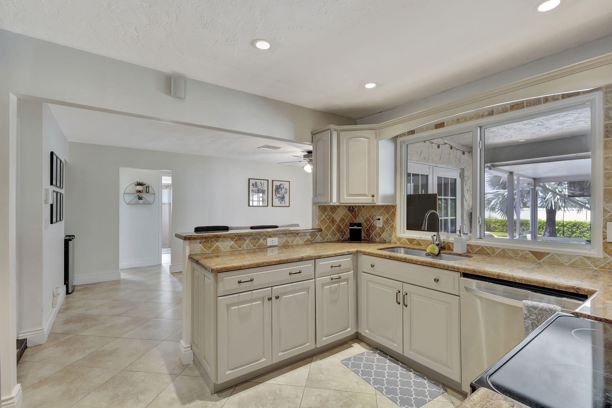 1104 Jackpine Street Wellington, FL 33414 - Photo 25 of 67 a kitchen with a sink and cabinets