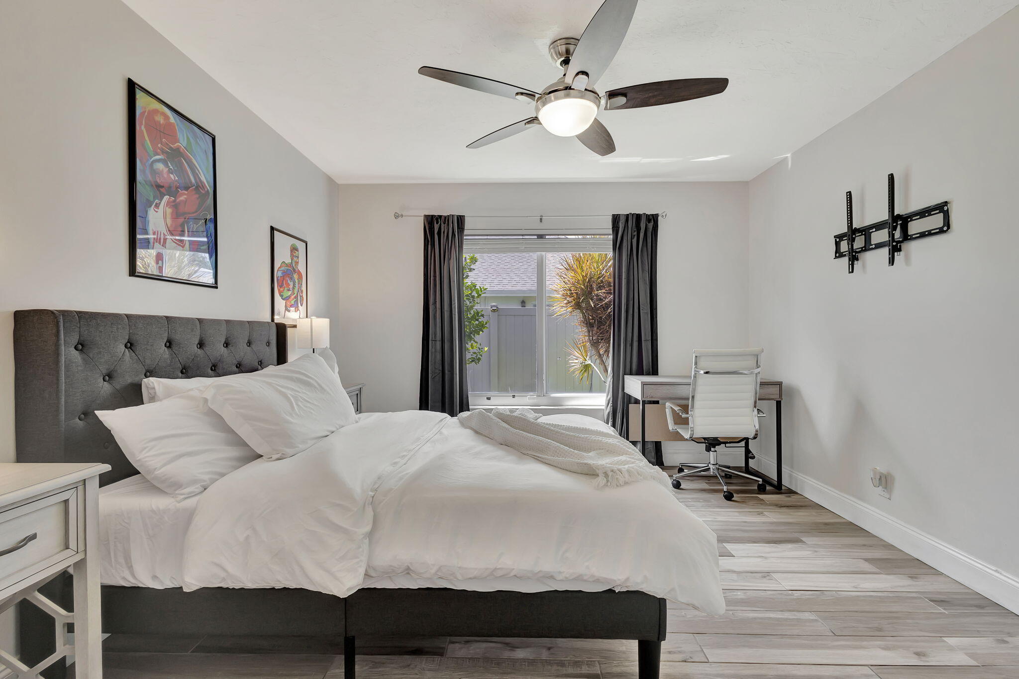 1104 Jackpine Street Wellington, FL 33414 - Photo 4 of 67 a bedroom with a bed and a chandelier