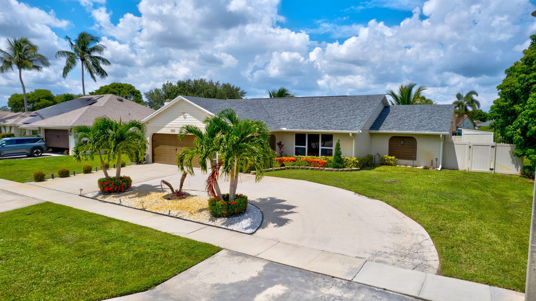 1104 Jackpine Street Wellington, FL 33414 - Photo 51 of 67 a front view of a house with garden