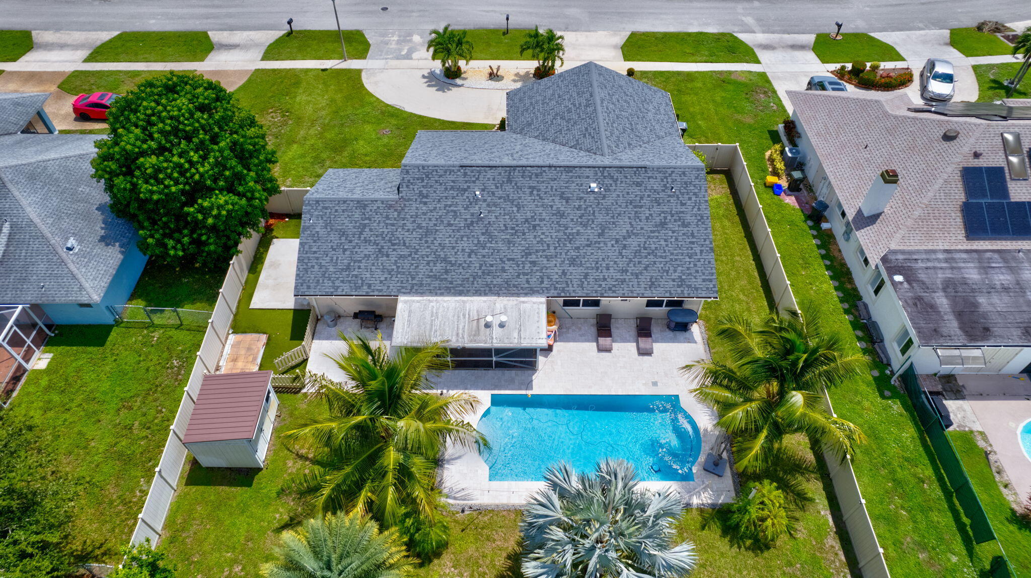 1104 Jackpine Street Wellington, FL 33414 - Photo 63 of 67 an aerial view of multiple houses with yard