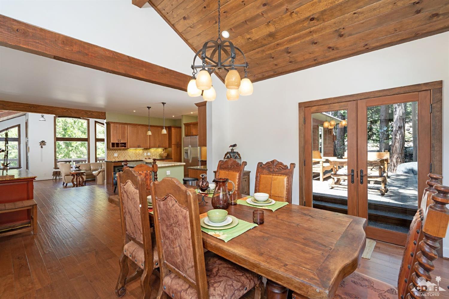 24838 Fern Valley Road Idyllwild, CA 92549 - Photo 12 of 38 a view of a dining room with furniture window and wooden floor