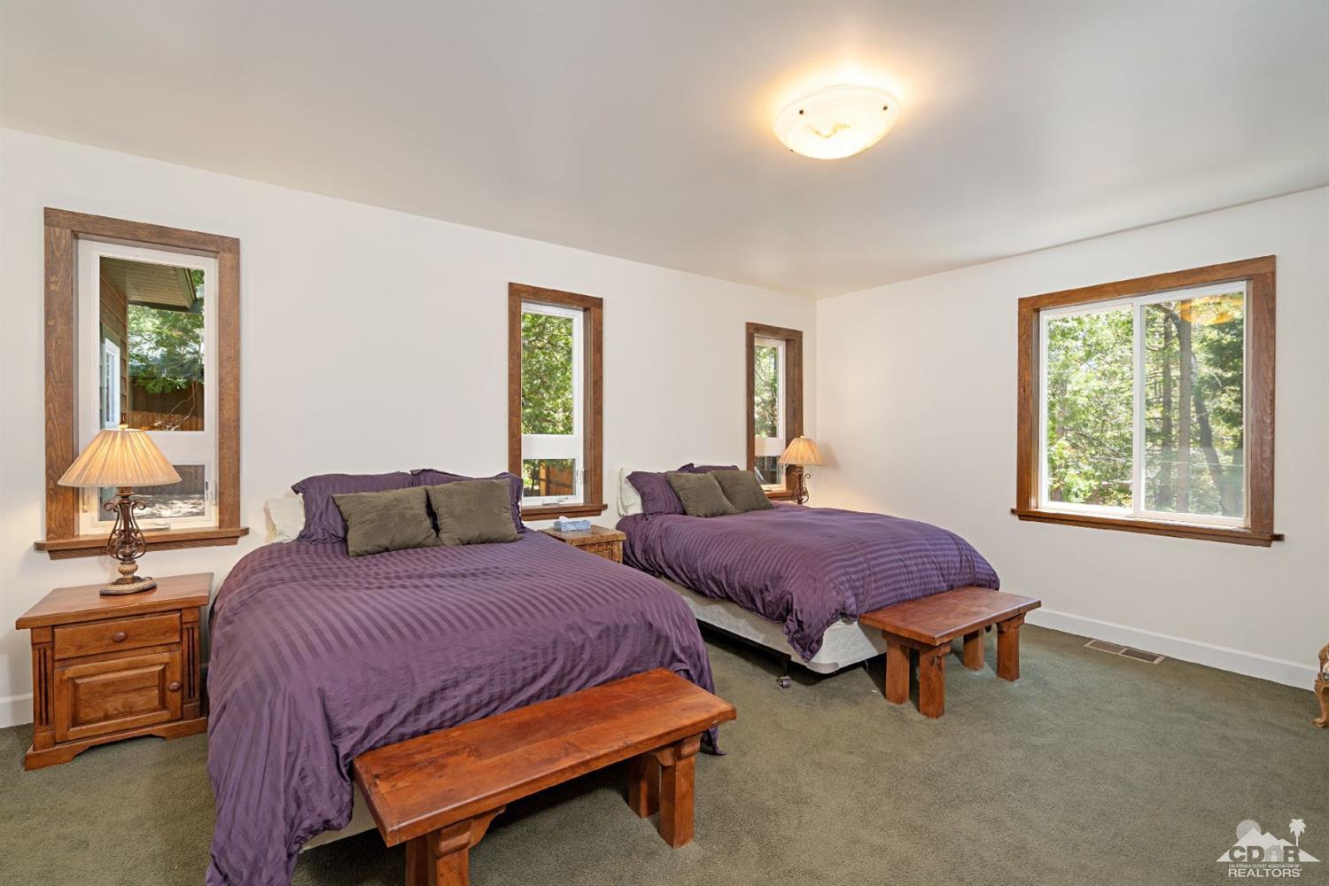 24838 Fern Valley Road Idyllwild, CA 92549 - Photo 17 of 38 a bedroom with two beds and windows