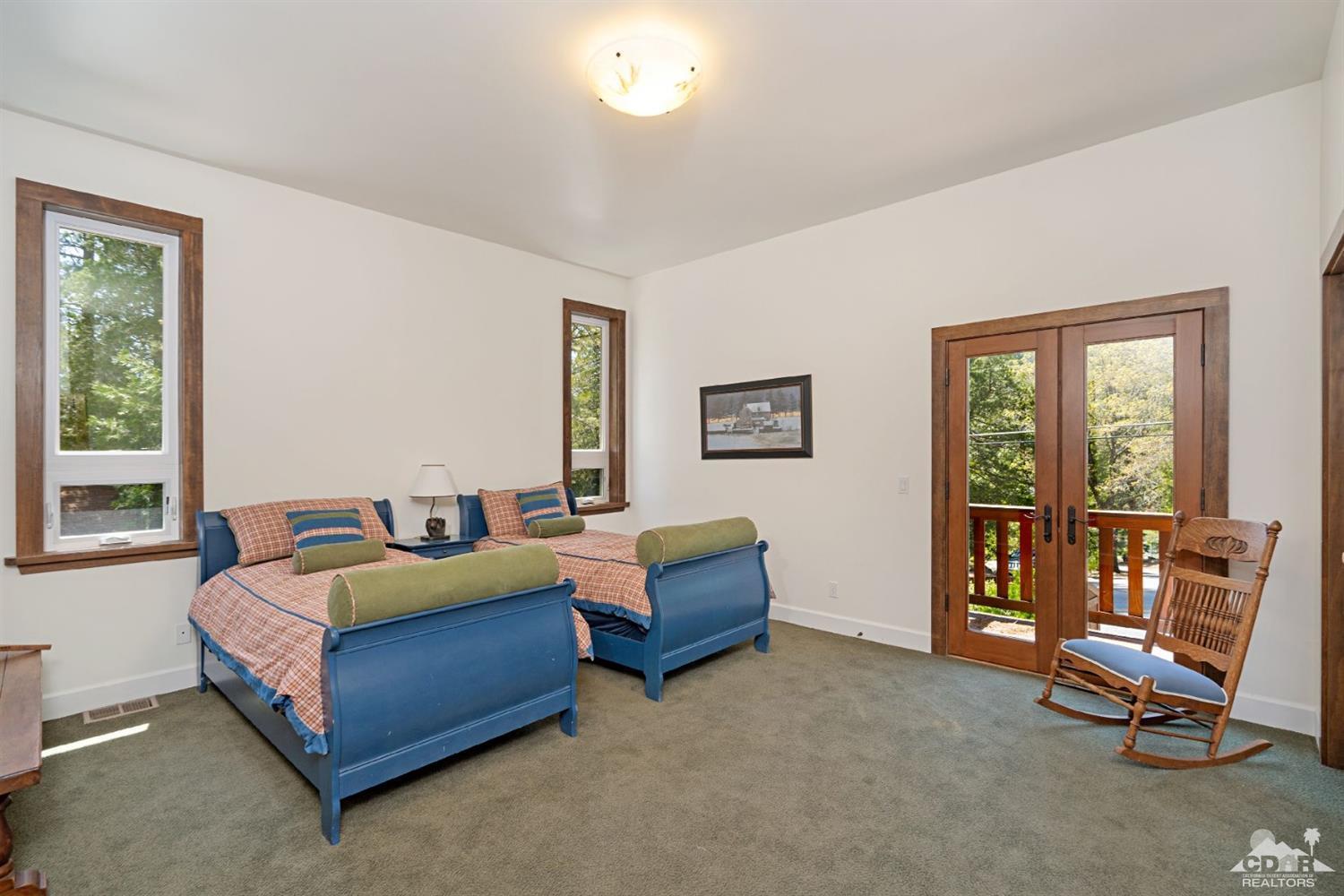 24838 Fern Valley Road Idyllwild, CA 92549 - Photo 21 of 38 a living room with furniture and a window