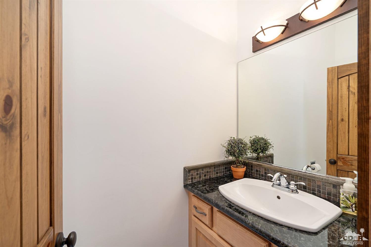 24838 Fern Valley Road Idyllwild, CA 92549 - Photo 23 of 38 a bathroom with a sink and a mirror