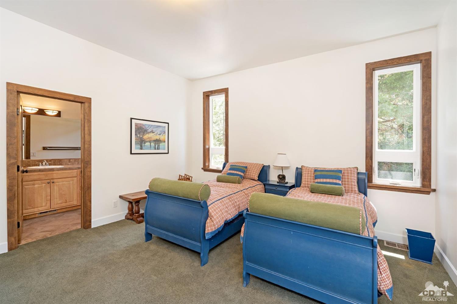24838 Fern Valley Road Idyllwild, CA 92549 - Photo 25 of 38 a bedroom with bed and window