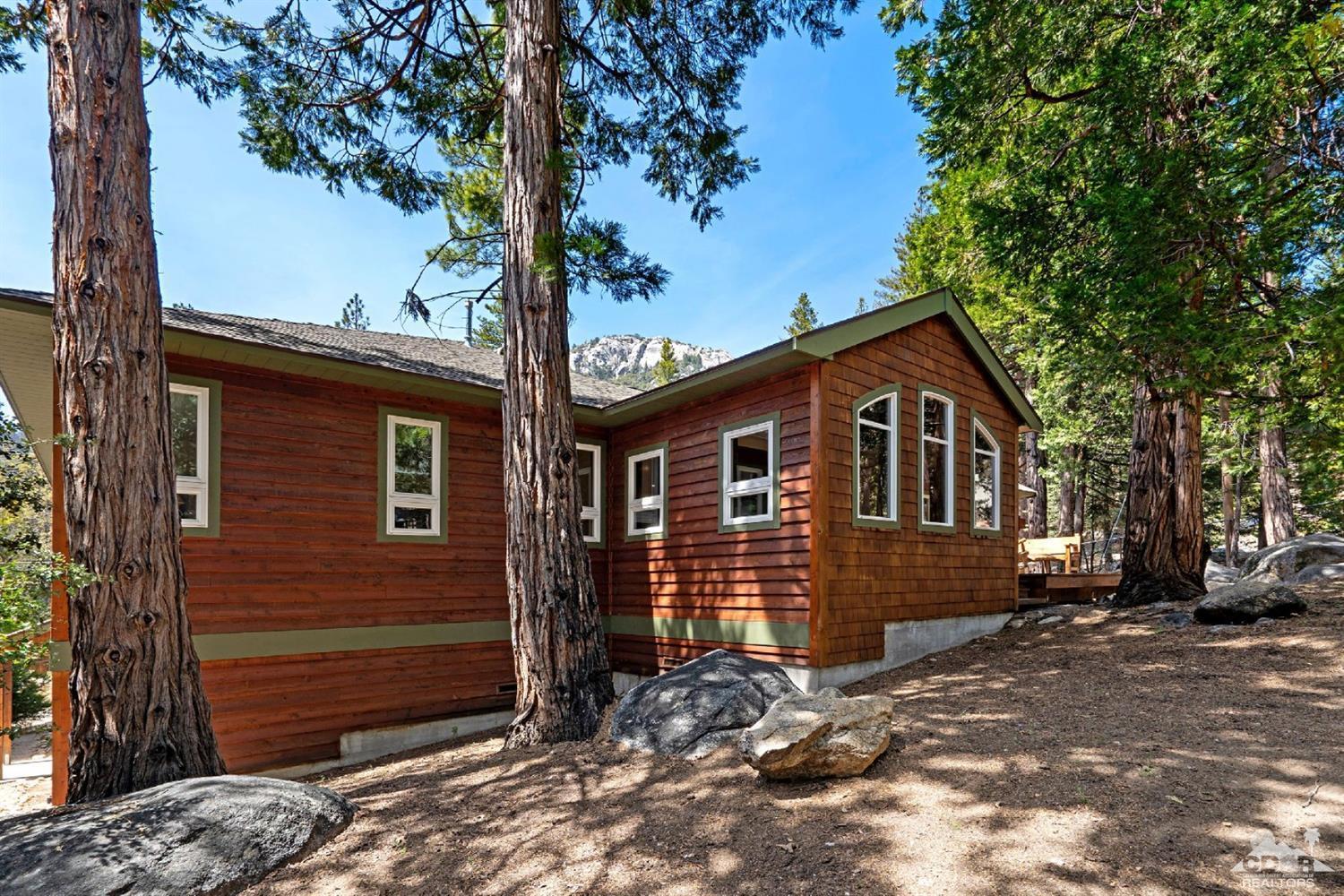 24838 Fern Valley Road Idyllwild, CA 92549 - Photo 28 of 38 a front view of a house with a garden